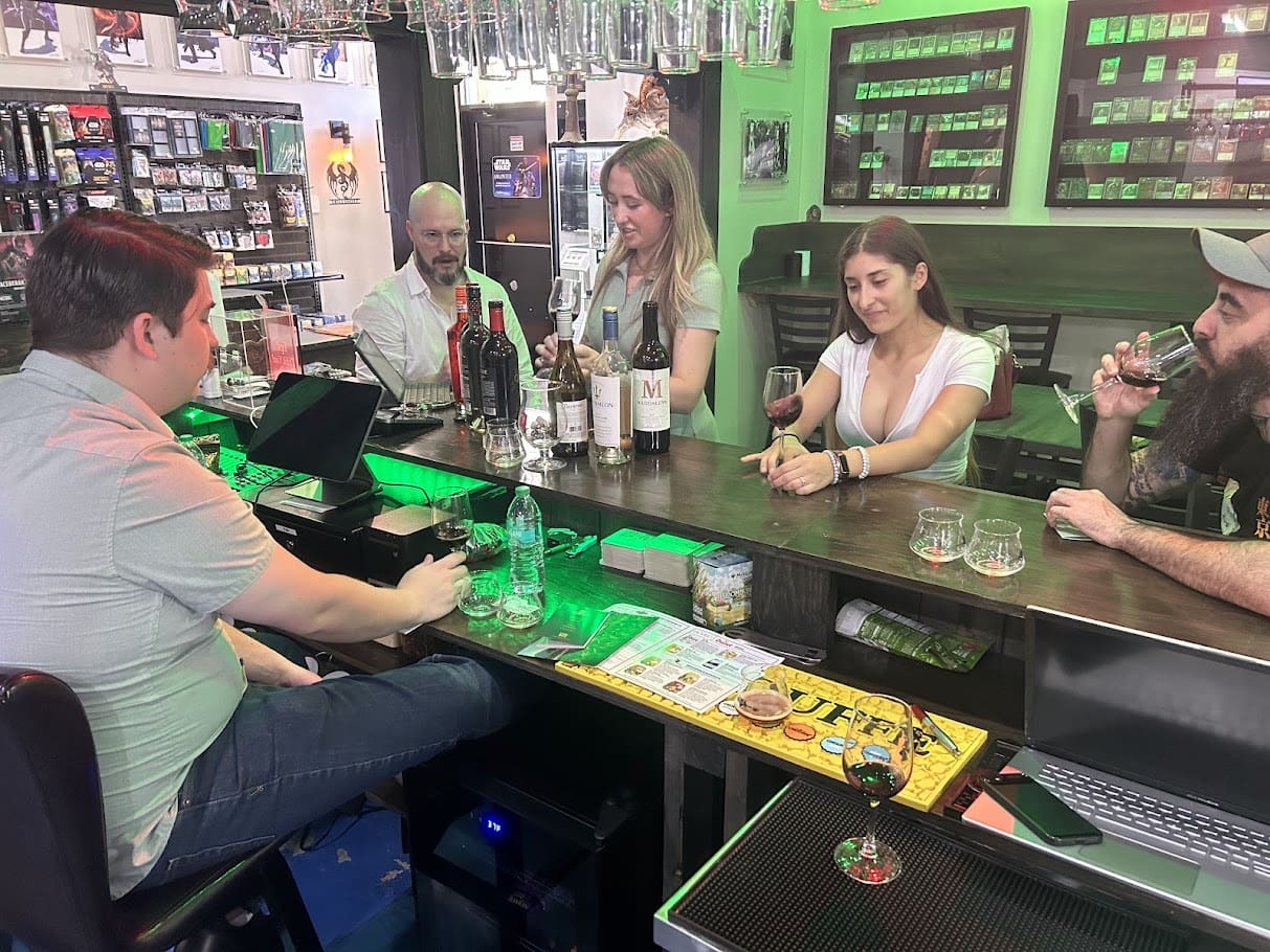 Guests enjoying wine and drinks at The Twisted Vine bar at Skillshotz Gaming in South Florida