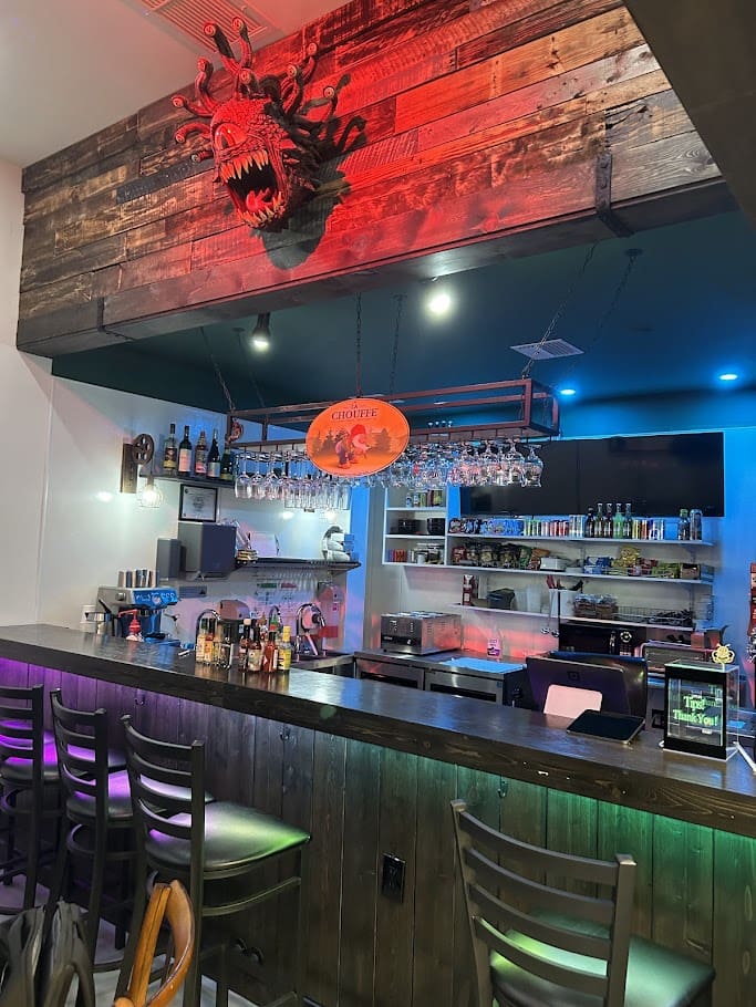 The Twisted Vine craft bar at Skillshotz Gaming in Deerfield Beach with dragon decor and craft drinks